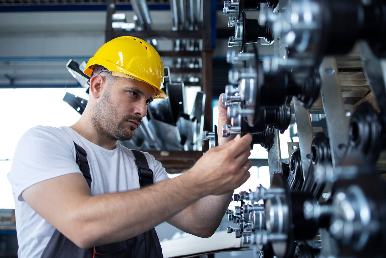 Machinist waiting at an idle CNC machine due to missing tooling